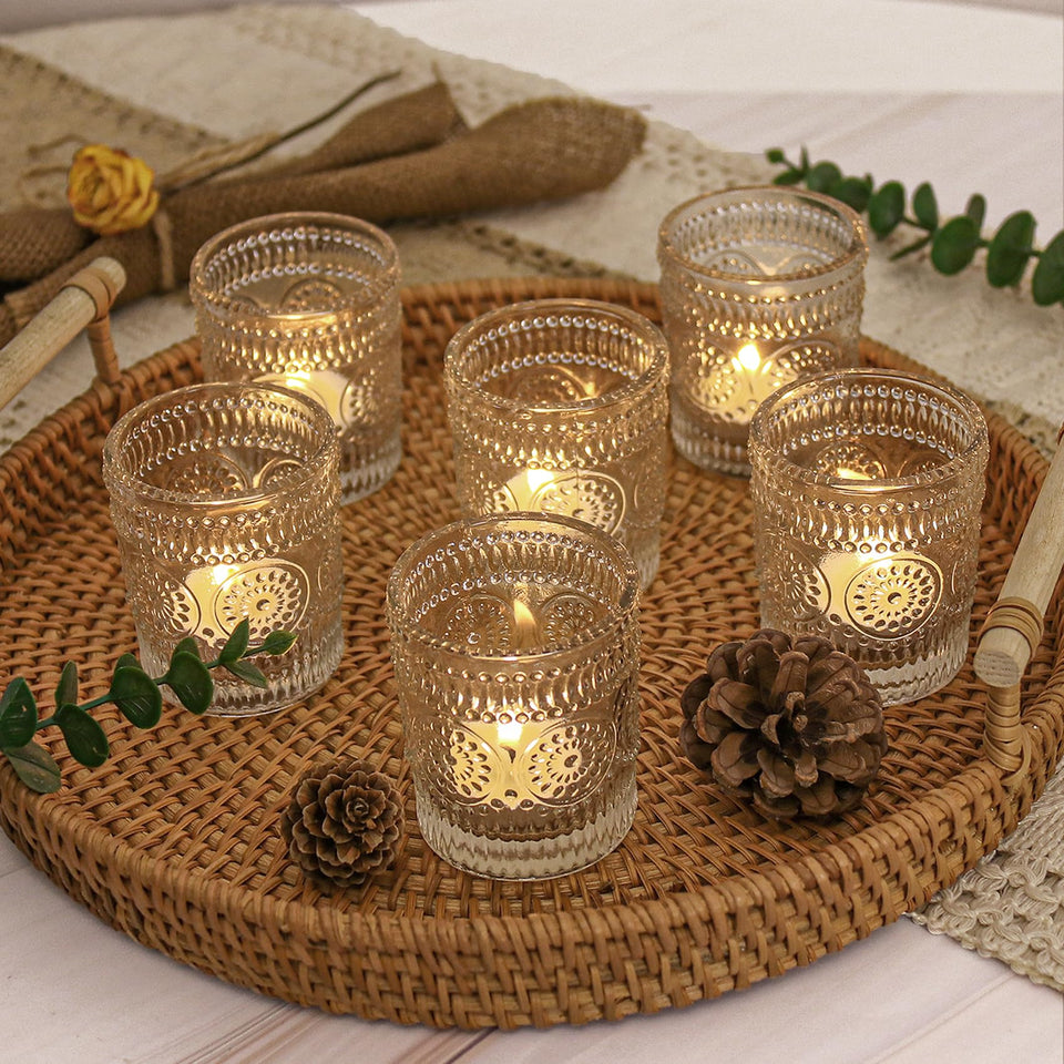 JALANCY clear glass votive holders highlight candlelight for elegant table centerpieces and safe flame use.