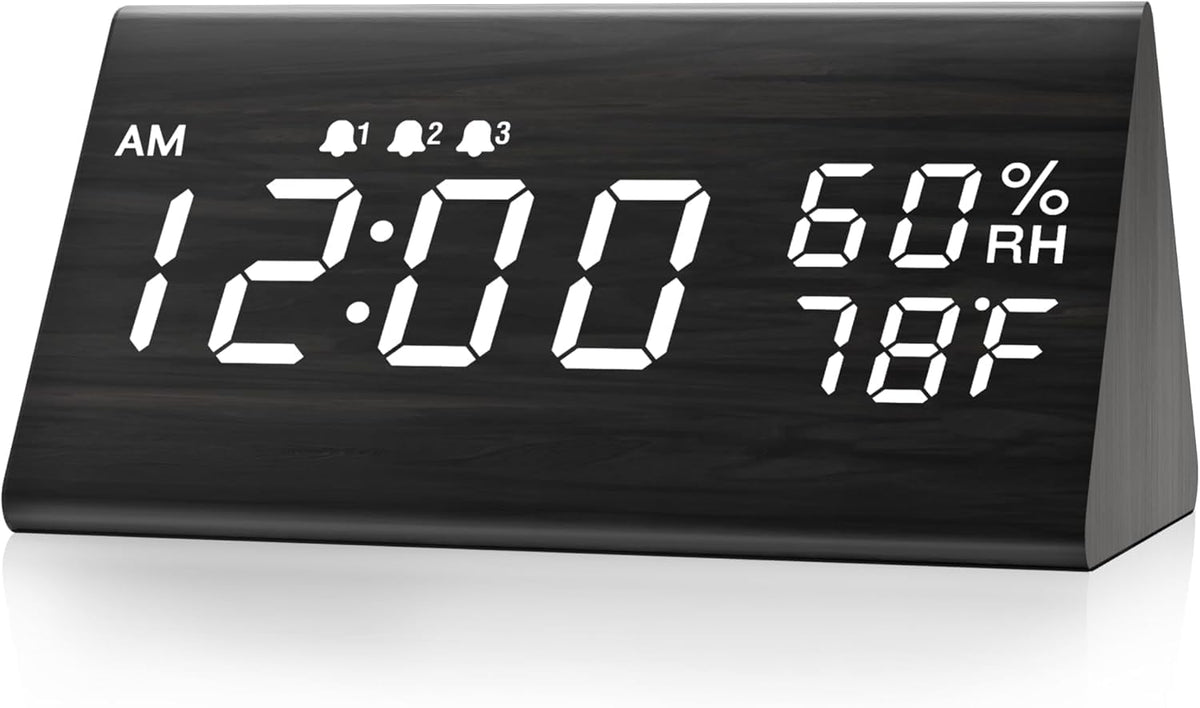 JALL digital alarm clock with wooden LED display enhances a modern bedside setup.