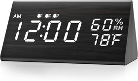 JALL digital alarm clock with wooden LED display enhances a modern bedside setup.
