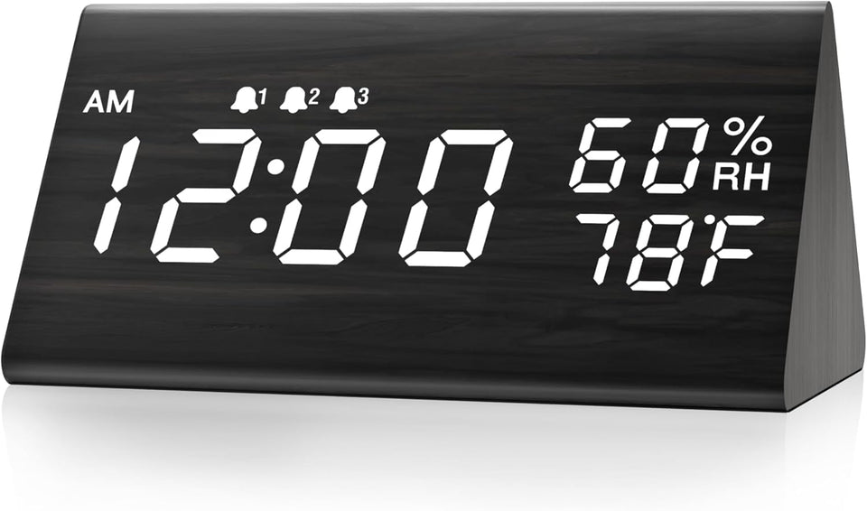 JALL digital alarm clock with wooden LED display enhances a modern bedside setup.