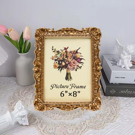 JANDERART ornate gold frame back reveals versatile display options for tabletop or wall.