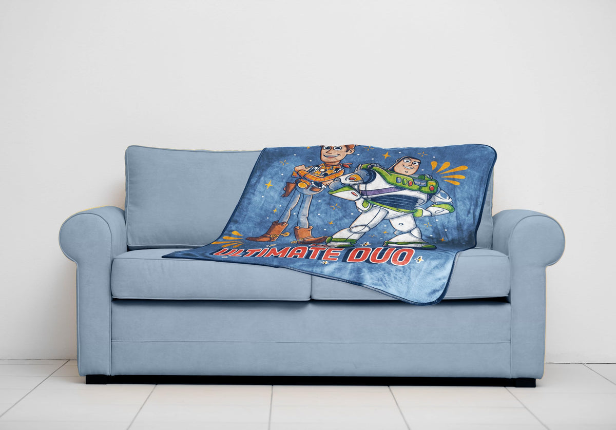 Jay Franco 40x50 inches throw on bed showcasing versatility.