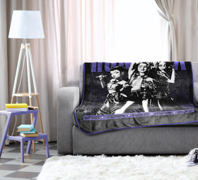 Jay Franco Demon Hunters Huntrix blanket on couch ideal for movie nights