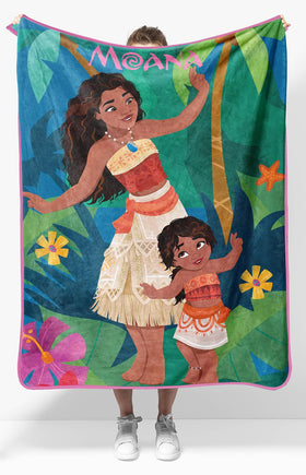 Jay Franco Disney Moana plush throw blanket on couch for cozy family nights.
