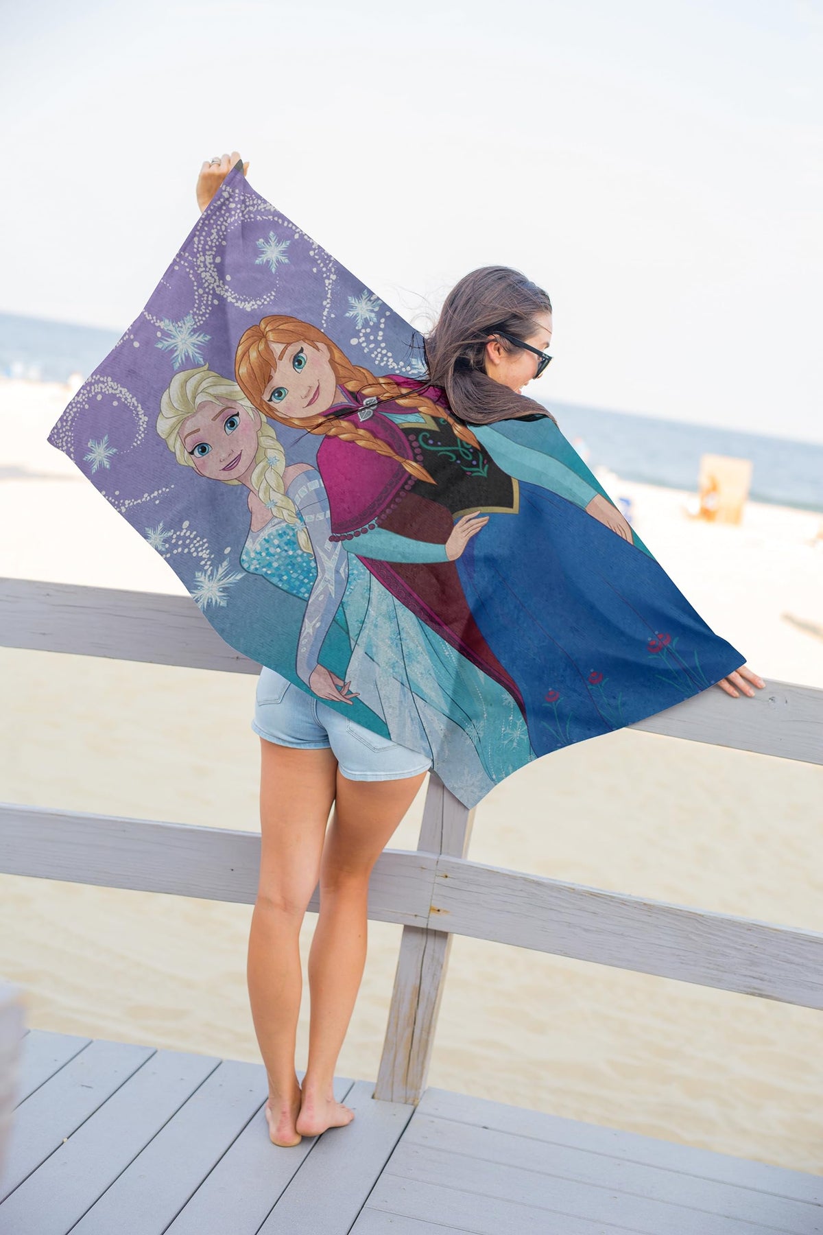 Frozen 2 towel with vibrant Elsa and Anna artwork enhances kids' drying after washing.
