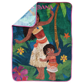 Moana design layered on a bed adds color and warmth.