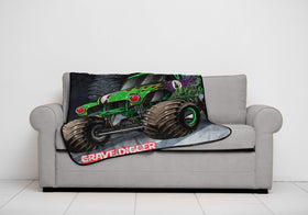 Child snuggles with Jay Franco Monster Jam throw during bedtime.