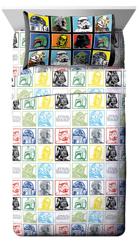 The reversible comforter shows two looks in the Jay Franco Star Wars Grid set.
