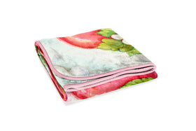 Jay Franco Strawberry Shortcake throw on bed, bright design for kids' rooms and lounges.