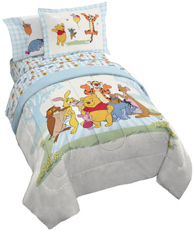 Jay Franco Winnie the Pooh 5-piece twin bed set, cozy comforter close-up for kids' rooms.