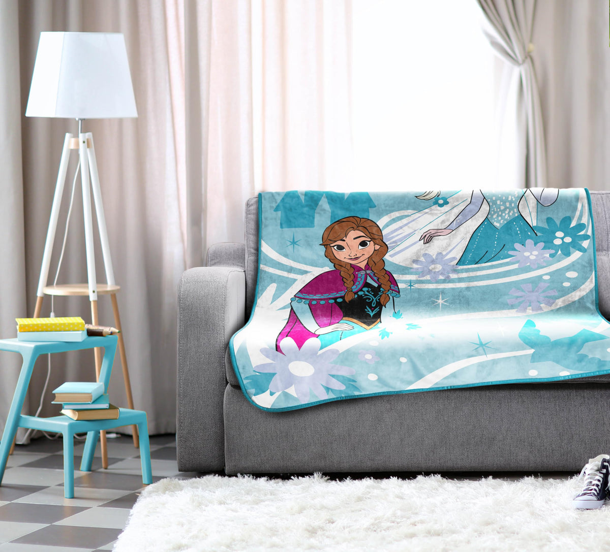 Closeup of Elsa and Anna print on Jay Franco fleece blanket.