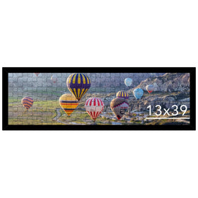 JCJMY 13x39 frame displaying puzzles in a sleek black setup for an organized wall display