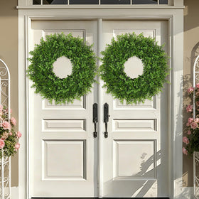 JDKPK boxwoods wreath on a bright doorway, showcasing durable, fade-resistant greenery
