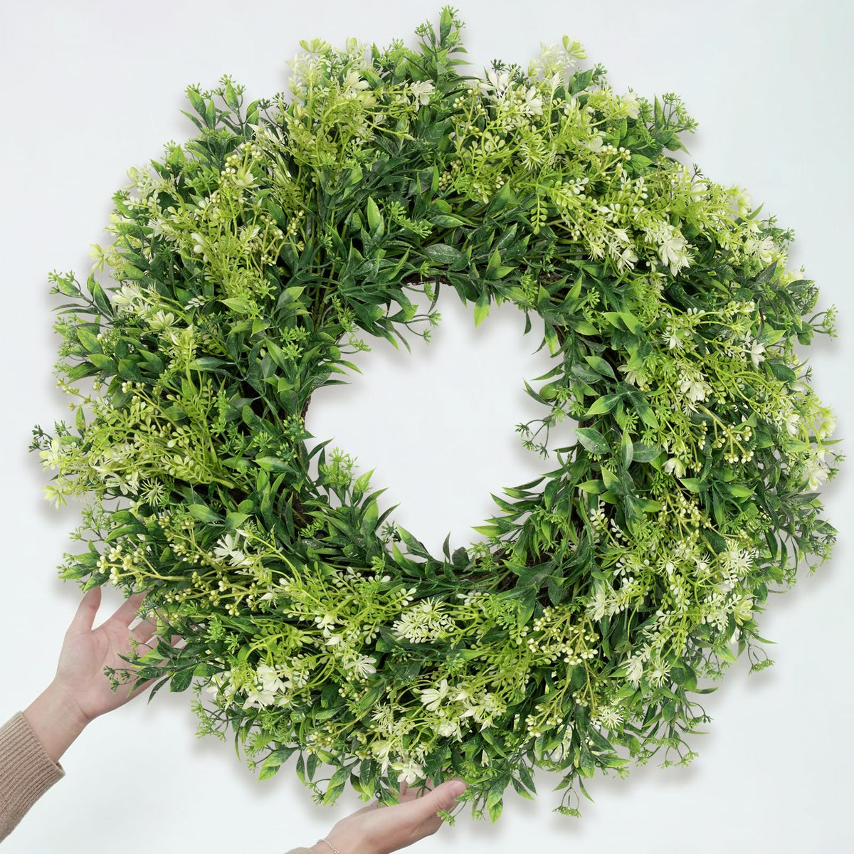 JDKPK white and green berries add delicate accent to any doorstep.