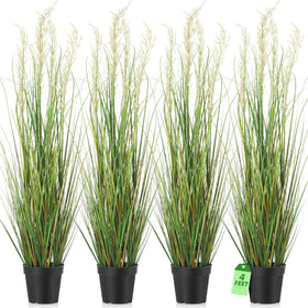Jexine four-foot tall artificial grass plant in a black pot for instant greenery.