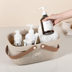 JiatuA bathroom storage basket helps tidy countertops and shelves.