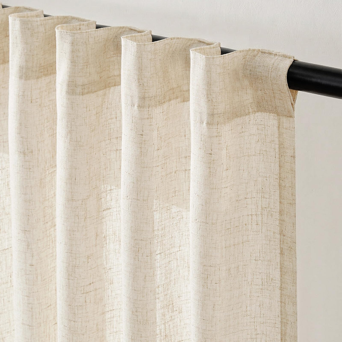Beige Jinchan curtains styled in a dining room for soft glow.