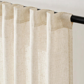 Beige Jinchan curtains styled in a dining room for soft glow.