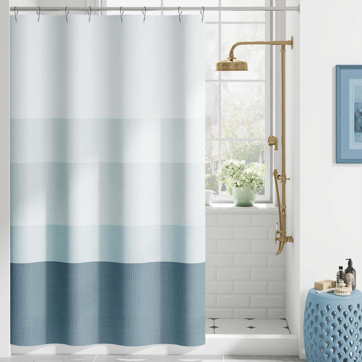 Jinchan ombre striped shower curtain showcases gradient blues for a chic bathroom update.