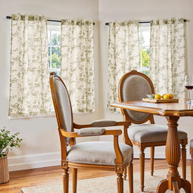 Jinchan sage green on beige fabric close-up shows soft linen texture for cozy spaces.