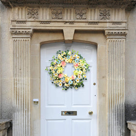 JINGHONG wreath highlights eucalyptus greens and berry clusters