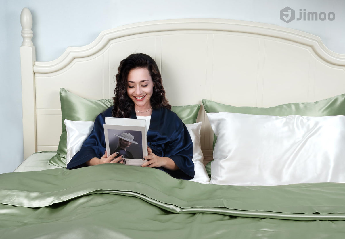 Close-up texture of J JIMOO silk reveals soft, breathable fabric.