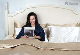 J JIMOO silk pillowcase on bed illustrates beige luxury and comfort.