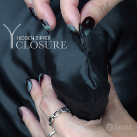 J JIMOO silk pillowcase being touched to show soft texture with low friction.