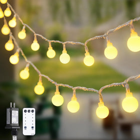 JMEXSUSS 100ft globe string lights illuminate outdoor spaces with expansive warm glow.