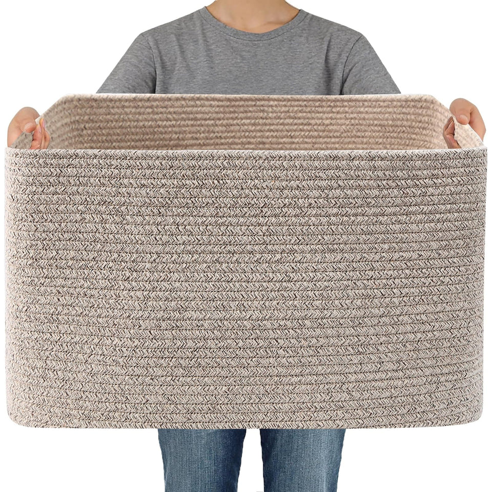 JMvicyroam woven basket holding blankets, a neat storage solution for cozy spaces.