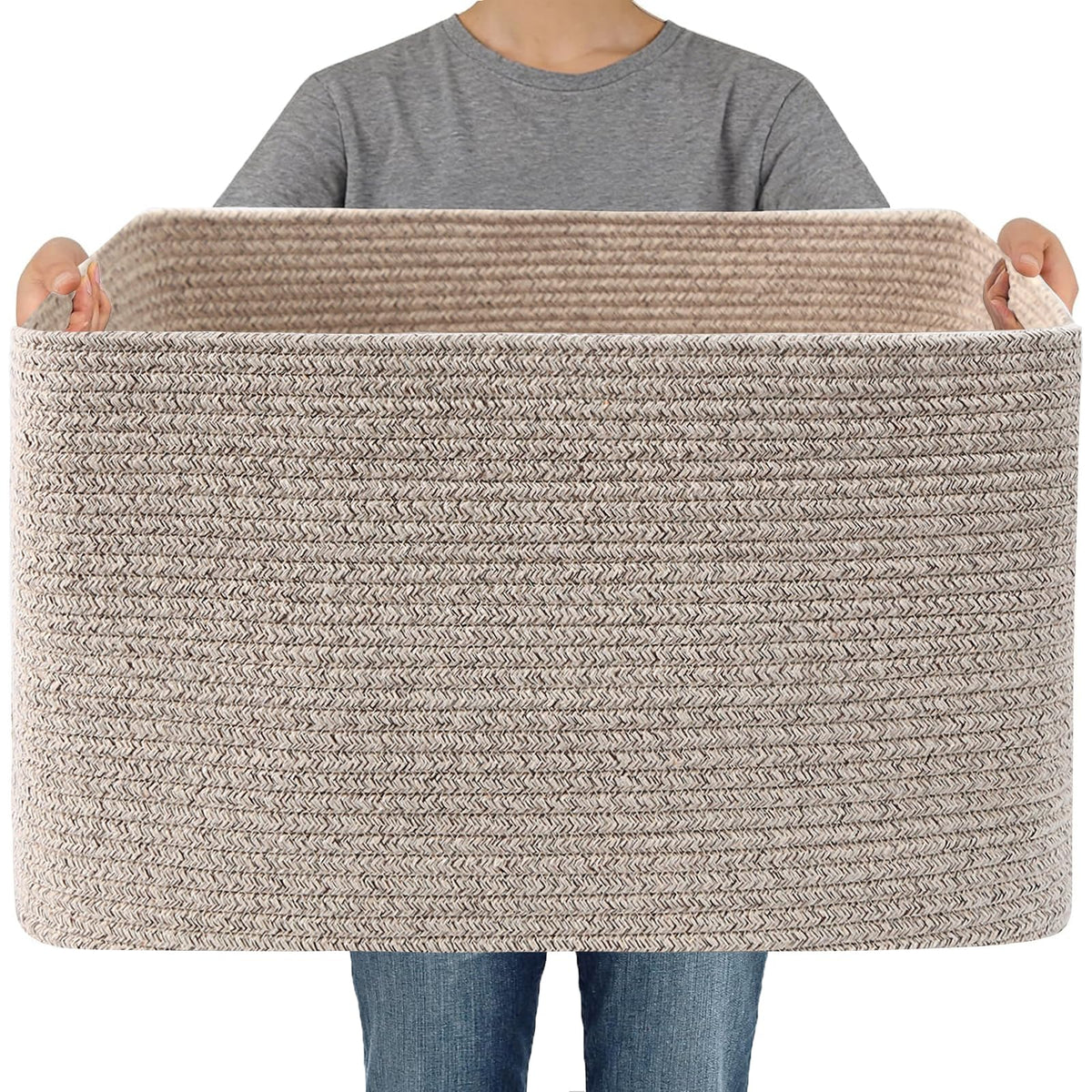 JMvicyroam woven blanket basket stores blankets and throws in a cozy living room.