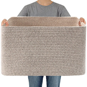 JMvicyroam woven blanket basket stores blankets and throws in a cozy living room.