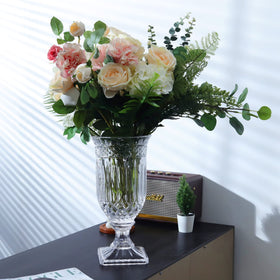 Joeyan clear glass vase features thick base for added stability.