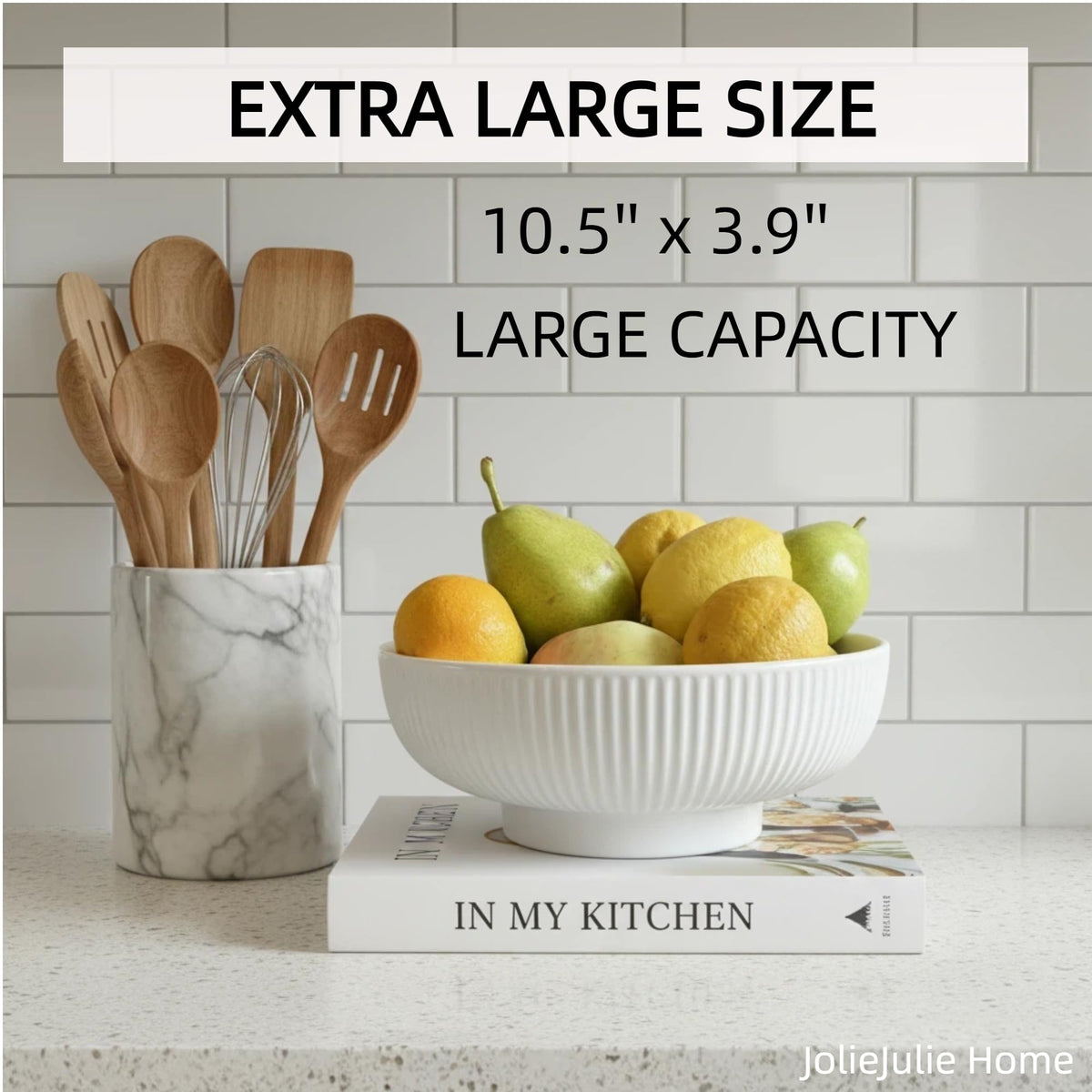 JolieJulie ceramic fruit bowl on dining table as a modern centerpiece with fruit.
