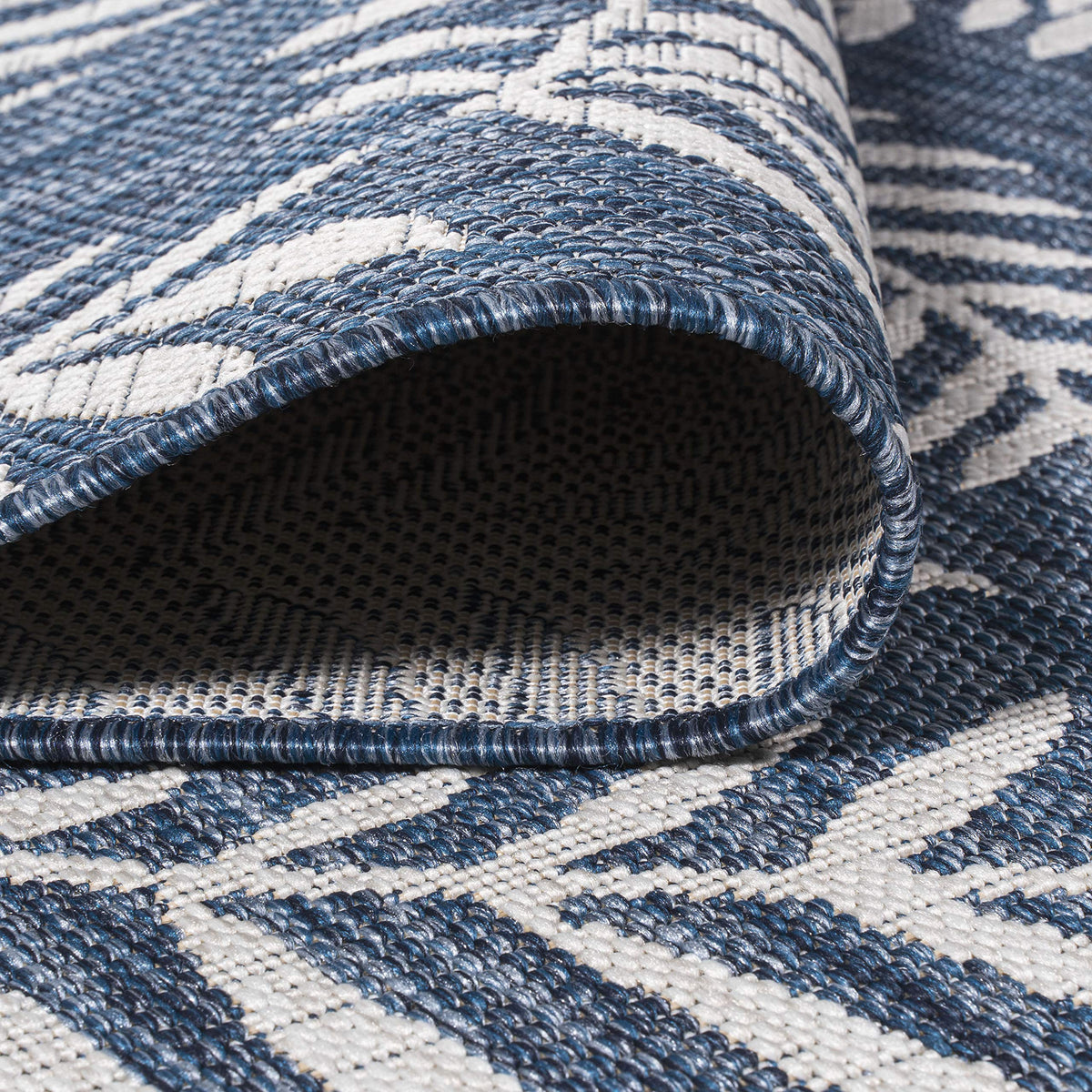 Jonathan Y pet-friendly rug that cleans spills quickly on outdoor surfaces.