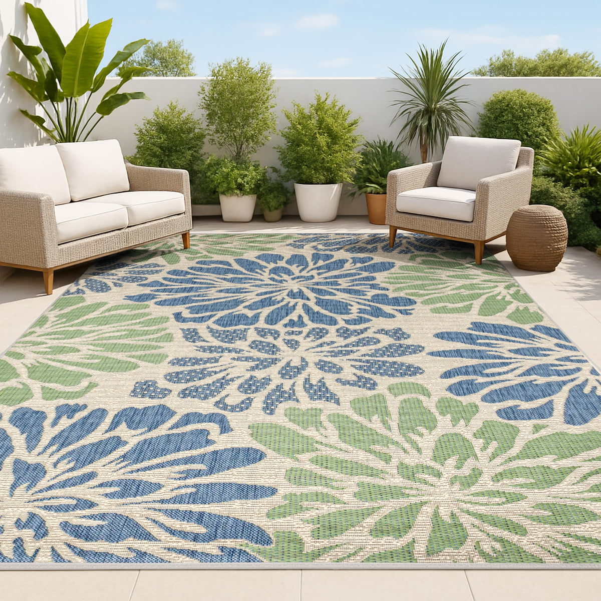 Jonathan Y floral textured weave rug; navy and green tones for outdoor spaces.