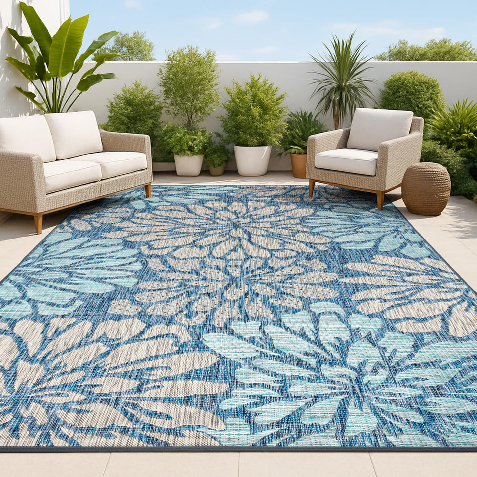 Jonathan Y floral textured weave rug shows navy and aqua blooms for outdoor durability.