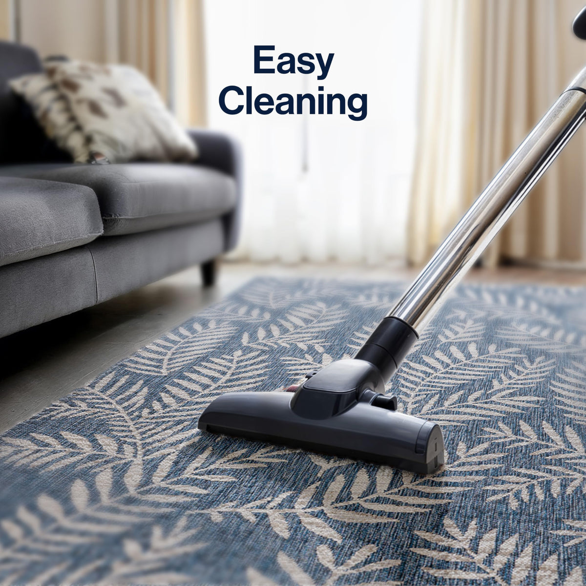 Jonathan Y stain-resistant rug maintains color in sunlit decks.
