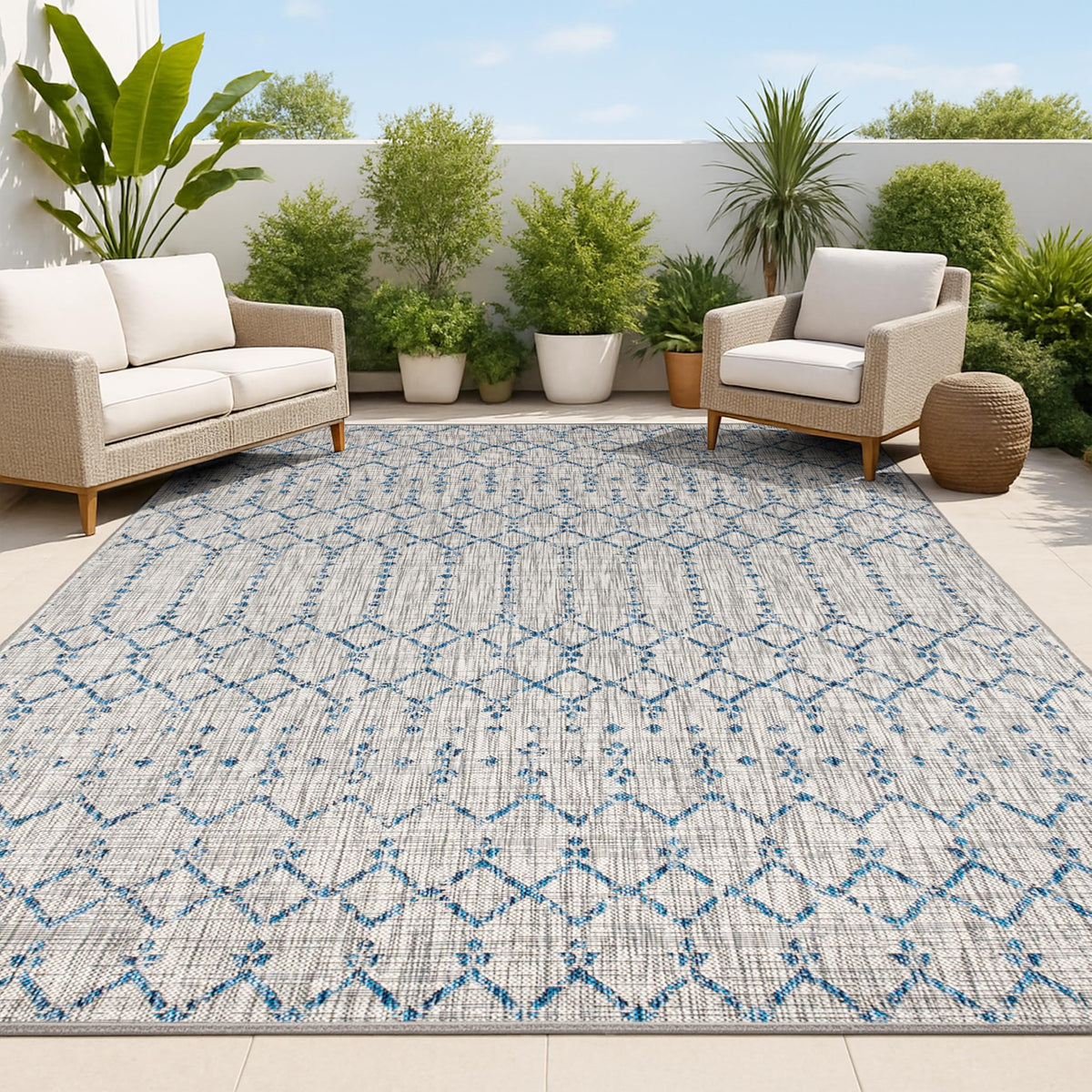Jonathan Y Ourika geometric rug in light gray and navy for outdoor spaces.