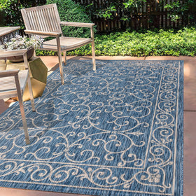 Jonathan Y navy-gray porch rug on steps highlights quick spills cleanup
