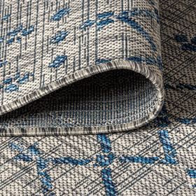 Jonathan Y Ourika pet-friendly outdoor rug resists staining and fading.