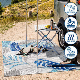 JONATHAN Y Tropics rug on patio setup demonstrates low-pile, easy-cleaning design.