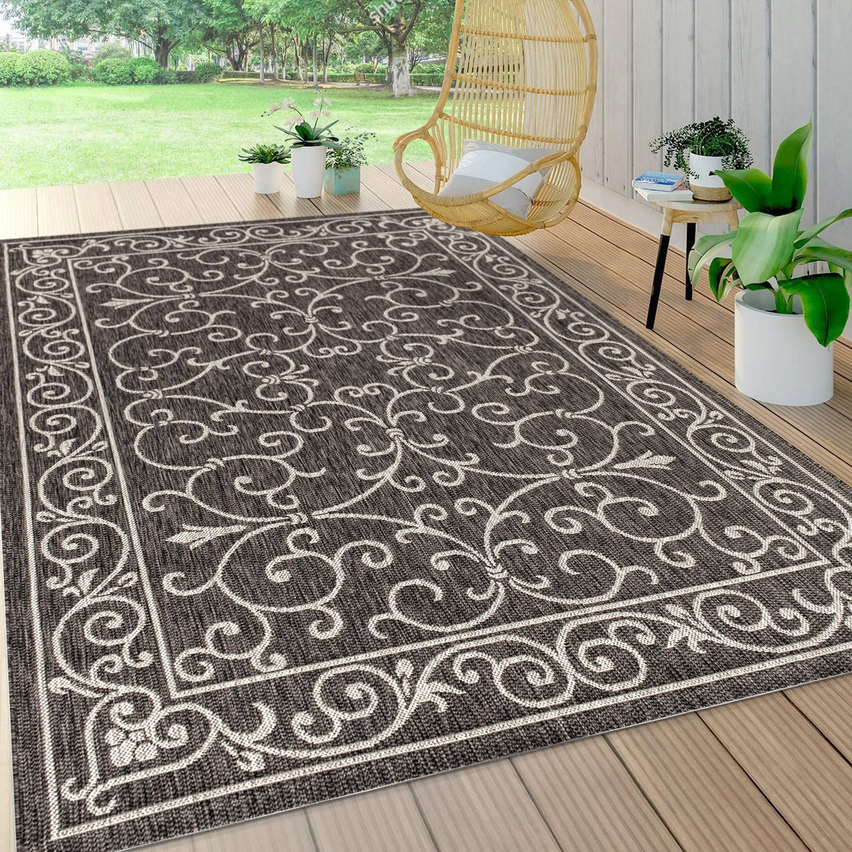 Jonathan Y vintage filigree rug in black and gray complements outdoor decor.