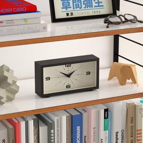 Jones Clocks Odeon rectangular case on mantel demonstrates compact elegance.