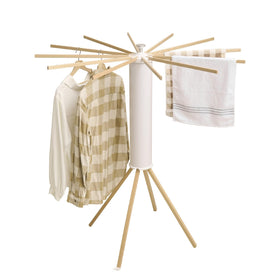 JOOM four legs drying rack folded for compact storage in small spaces.