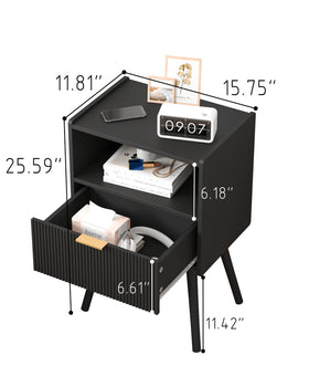 Open drawer on JOONEE black nightstand showing accessible interior storage.