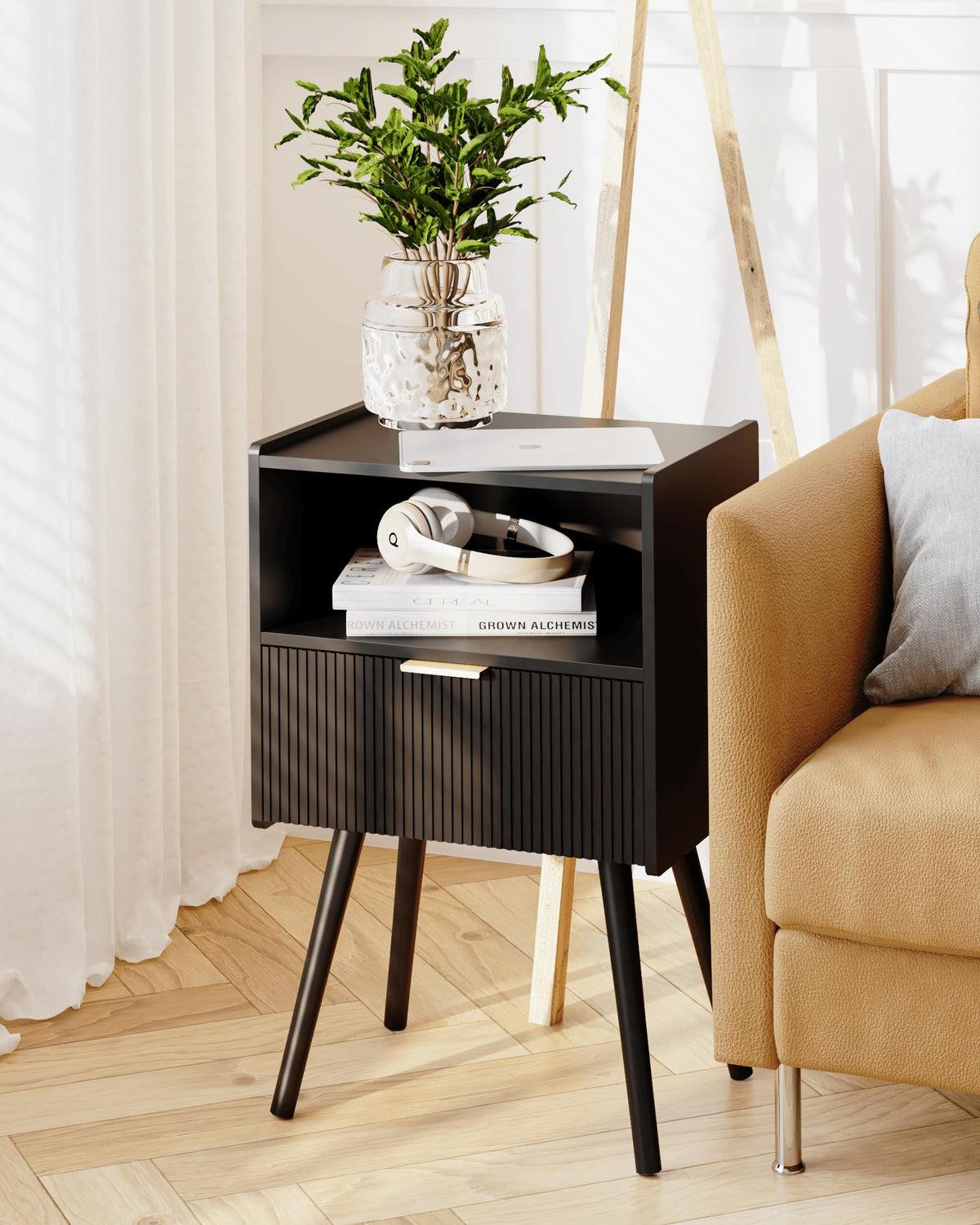 JOONEE nightstand placed in a modern living room setting.