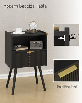 Top surface of JOONEE black nightstand holding a lamp and plant.