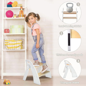 Toddler using Joothlin stool at kitchen sink for handwashing.