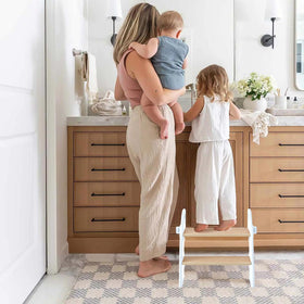 Joothlin stool beside toilet during potty training routine.